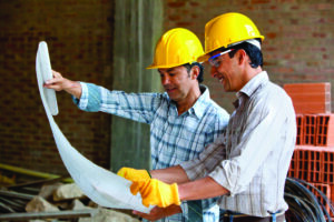 Skilled certified construction workers managing a commercial building site in Saudi Arabia