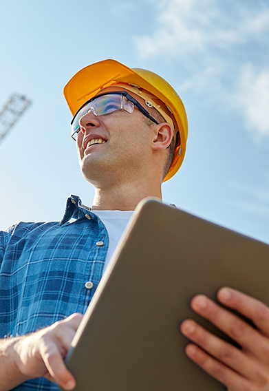 HOPEWAY team showcasing safety gear and international certifications at a project site